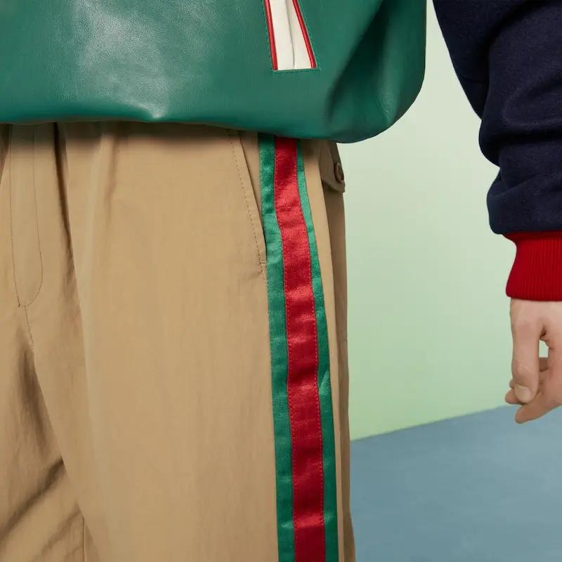 Gucci Зауженные брюки с вышитым логотипом 742772-ZANW8-2371