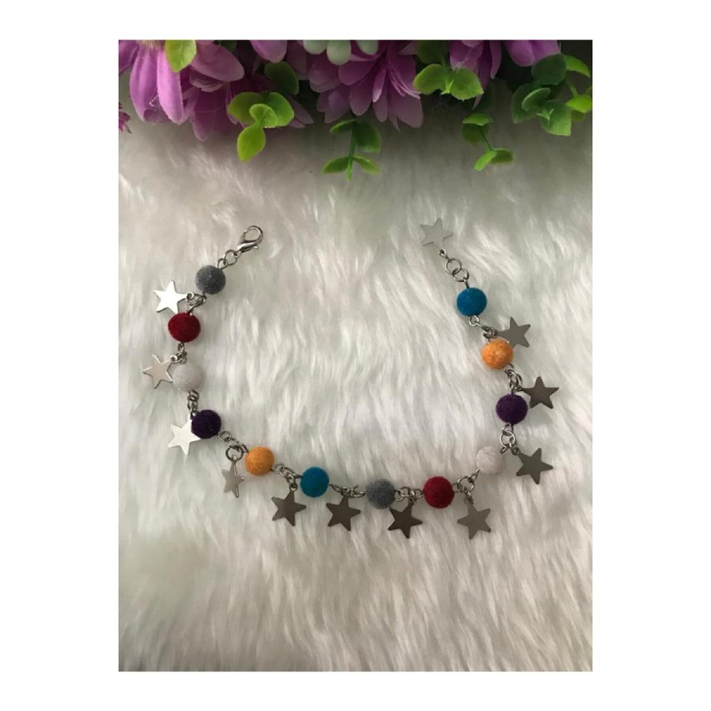 Женский браслет серого цвета со звездой