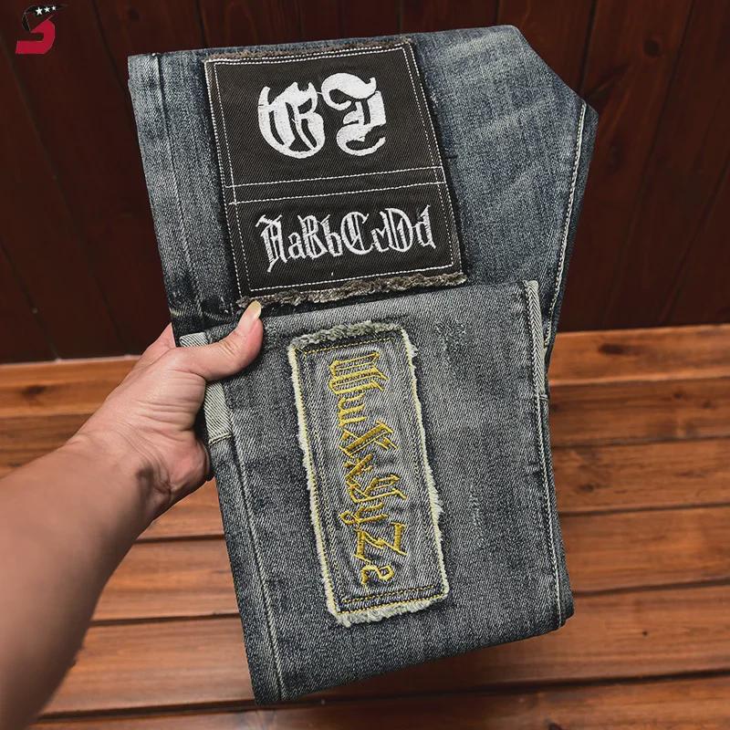 Мужские облегающие джинсы скинни с вышивкой и рваными краями на осень и зиму