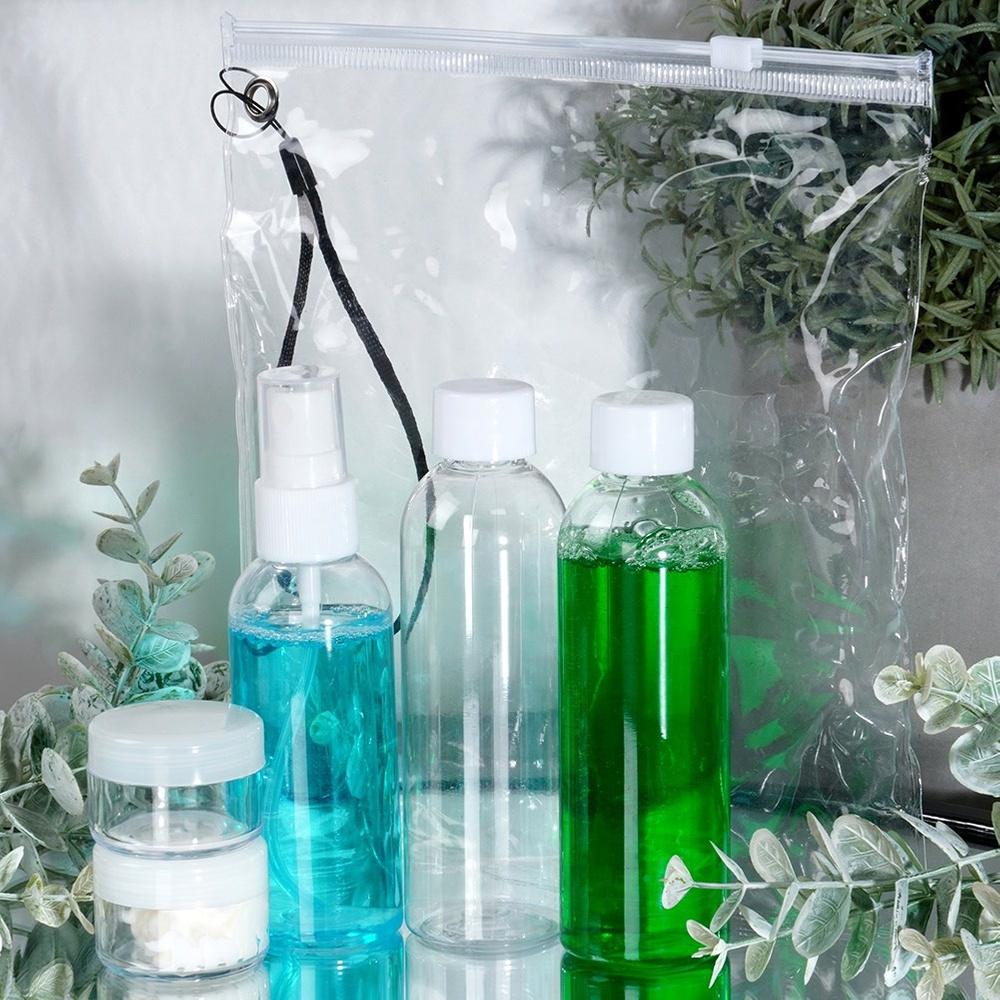 Bottles travel containers for cosmetics for the plane with a 5-piece cosmetics bag.