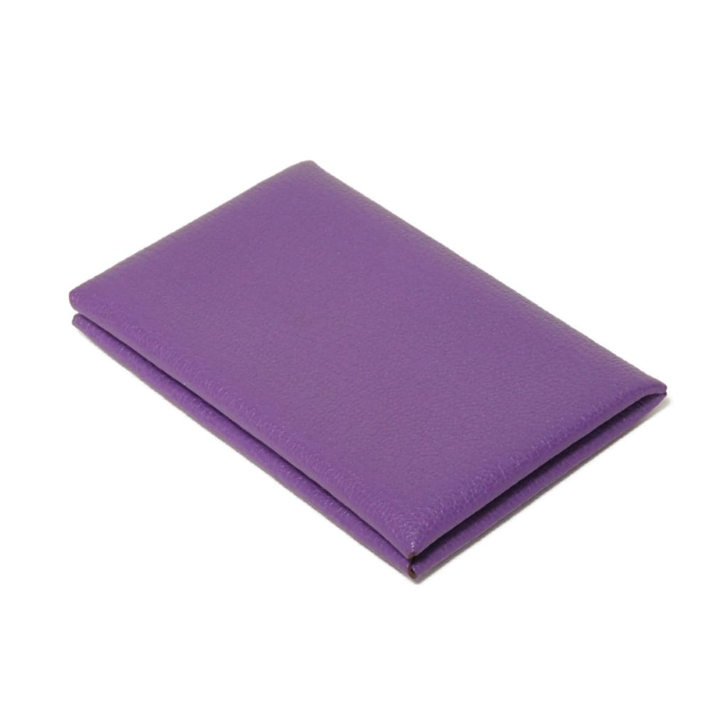 Used 9212 Calvi 7946 Chevre Mysore goatskin bag with gold-stamped logo and purple snap buttons. Excellent condition.