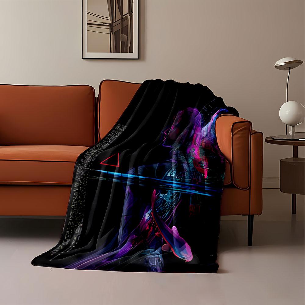 A neon-colored silhouette with abstract patterns, a fish, and a triangle. for all seasons blanket lunch break throw gift