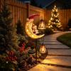 LED Glowing Christmas Moon Solar Stake Light with Bell Waterproof Solar Santa Snowman Light Iron Metal Hollow Lantern