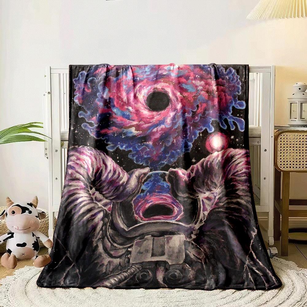An astronaut holding a glowing portal with a swirling galaxy pattern. for all seasons blanket lunch break throw gift