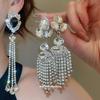 Серьги с кисточками из страз "Серебряная игла": Элегантные и привлекающие внимание серьги-гвоздики в форме капли воды для женщин