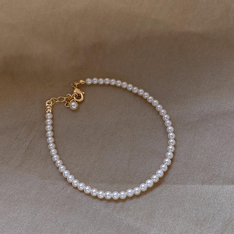 Элегантный браслет из стеклянного жемчуга: Простой многослойный дизайн с имитацией хрустальных жемчужин Шицзя для теплого, мягкого и женственного оттенка