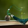 Vintage Green Sandalwood Tassel Pendant Sachet with Hollow Qipao Lapel Design