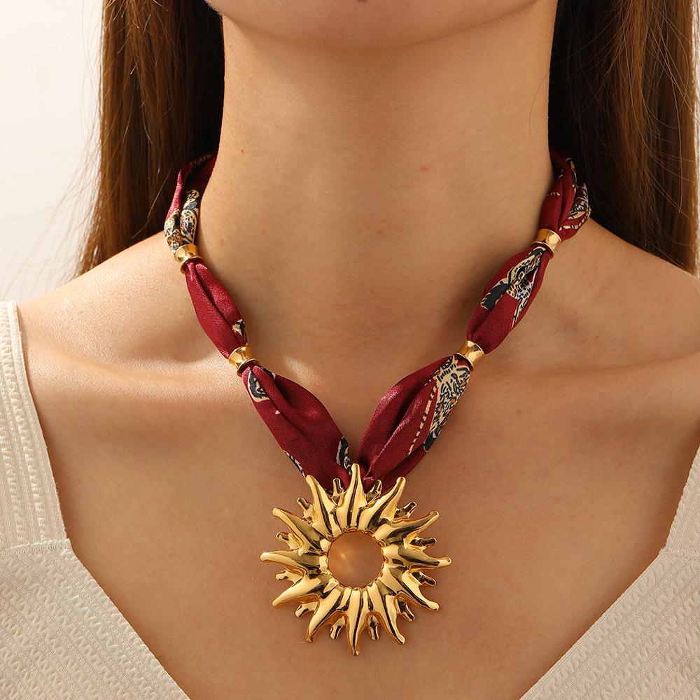 DIEYURO 316L Stainless Steel Golden Hollow Sun Totem Pendant Necklace Women New Fashion Burgundy Pattern Ribbon Chain Jewelry