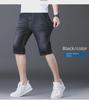 Popular Men's Cropped Four-Season Trousers: Elastic, Mid-Waist, and Trendy 7-Point Regular Denim for Youthful Style