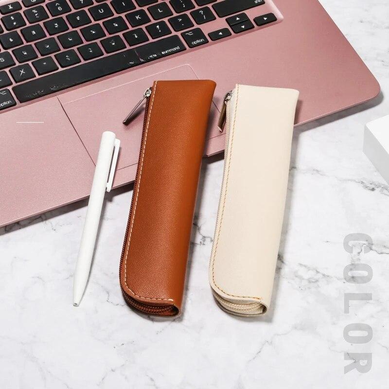 Маленькие изысканные сумки-карандаши из искусственной кожи. Красивые однотонные сумки для ручек. Простые легкие сумки для ручек. Сумки на молнии.