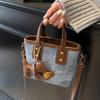 Корейская версия женской сумки осень и зима сумка-ведро для поездок на работу женская 2025 новая универсальная портативная сумка-тоут премиального качества сумка через плечо