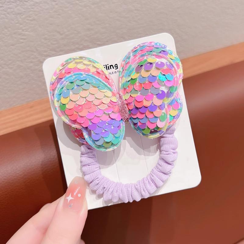 Детская резинка для волос с пайетками в виде бабочки не повредит волосы. Идеально подходит для высоких хвостов или в качестве головного убора для девочек.