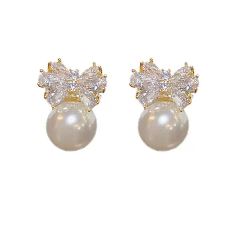 Zircon bow temperament pearl no earrings earrings women's niche design earclips mosquito coil disc high-end earrings