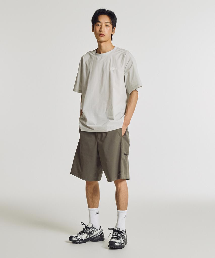 New Balance Nbneg31623 / Женская футболка с коротким рукавом Uni Frozen Essential, тканая (Светло-серый)