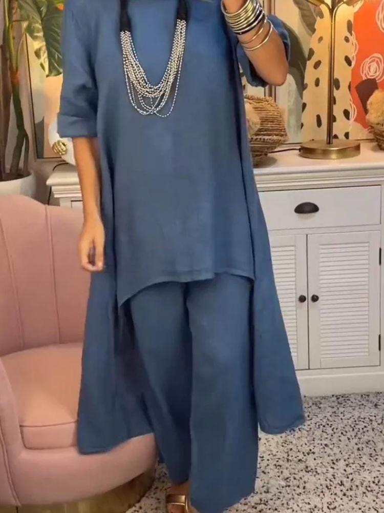 Женский комплект из свободной блузки с асимметричным подолом и брюк широкого кроя в нескольких цветах