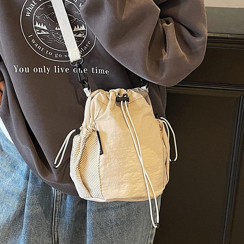 2025 New Japanese Leisure Niche Outdoor Sports Drawstring Bucket Bag Fashionable Versatile Light Travel Messenger Bag