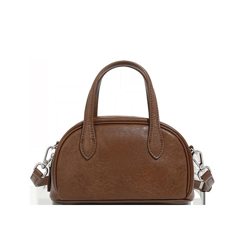 Женская сумка-боулинг Boston Bowling Bag из натуральной кожи растительного дубления Niche с одним плечом и через плечо
