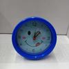Round, Multiple Smiling Faces and Small Alarm Clock