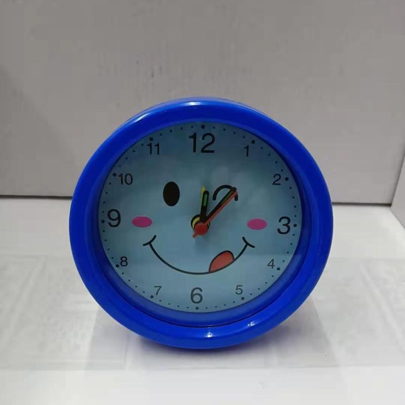Round, Multiple Smiling Faces and Small Alarm Clock