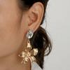 Flower Metallic Gold Earrings With Decorative Stones For Fashion And Celebration