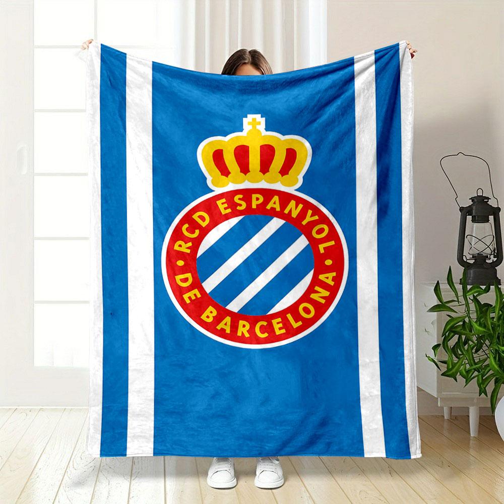 A blue background with white stripes and a crowned red circular emblem. for all seasons blanket lunch break throw gift
