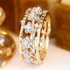 Two-tone hollow floral branch zircon ring Forest-style, artistic, and vintage floral ring with contrasting colors and a wide band