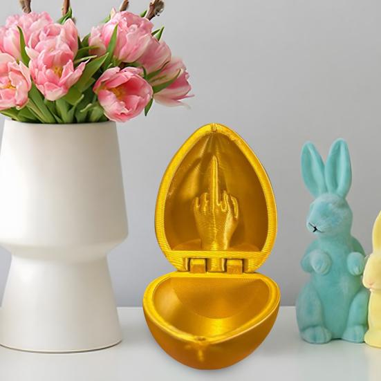 3D-печатная игрушка в виде яйца со средним пальцем. Цветное пасхальное яйцо со средним пальцем.