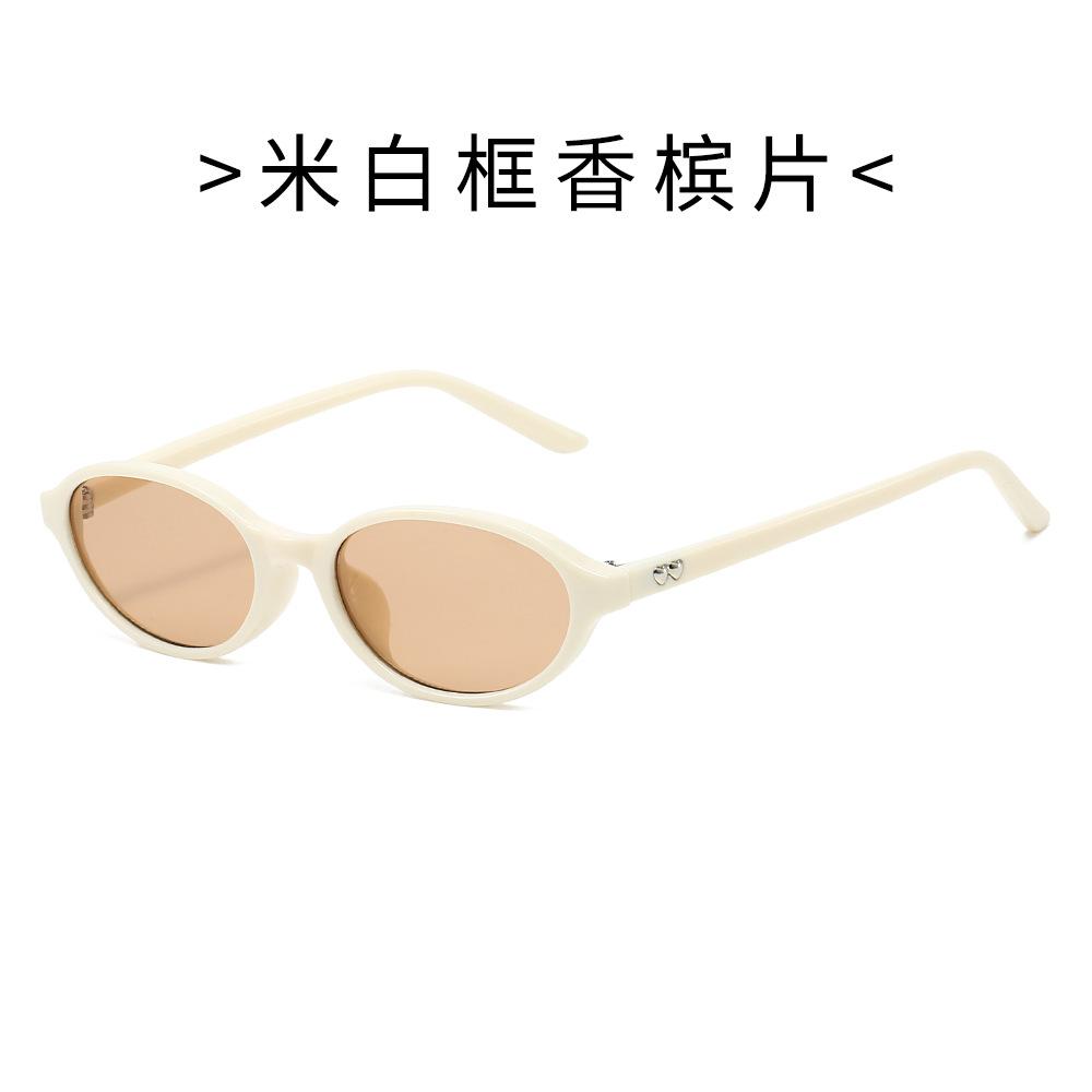 Oval frame sunglasses, retro style, heart-shaped temple arms, UV protection
