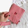 Red cherry canvas makeup bag, portable and easy to carry. Red plaid, large capacity cosmetic lipstick storage bag.