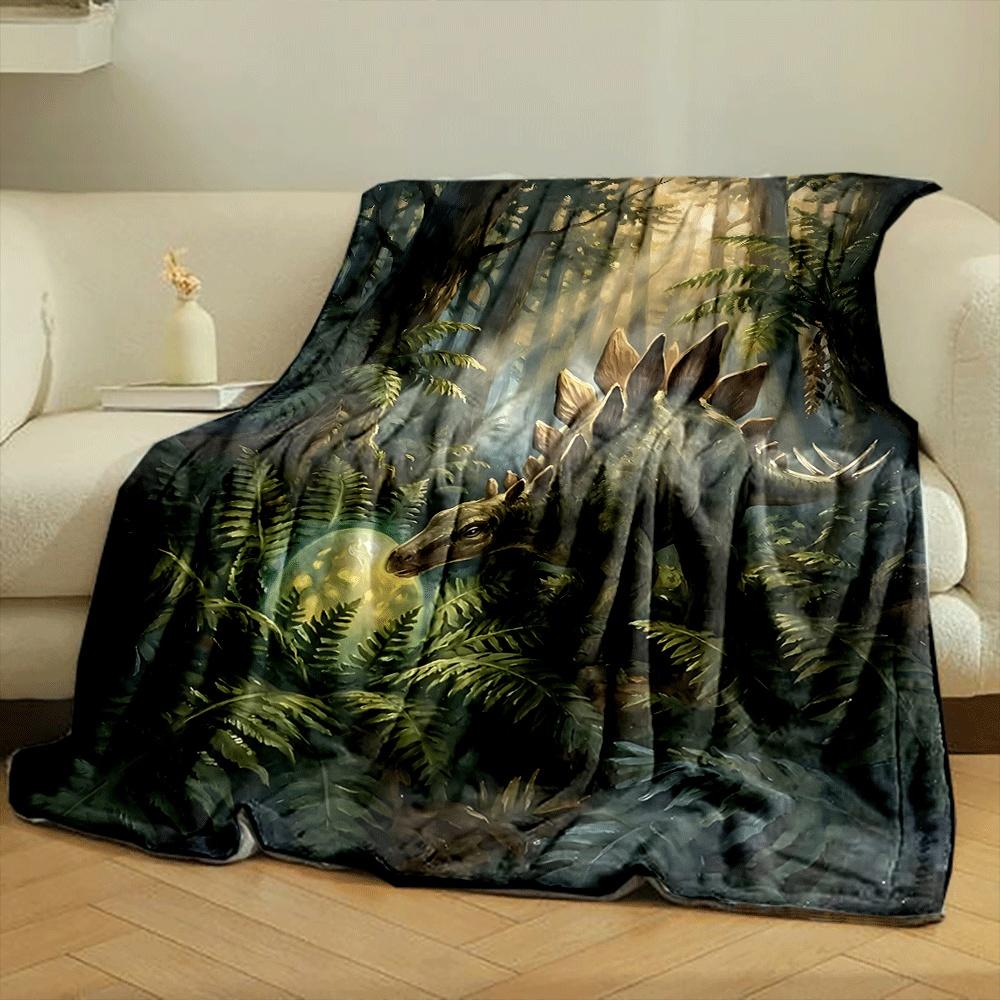 A stegosaurus in a lush forest examines a glowing egg among ferns. for all seasons blanket lunch break throw gift