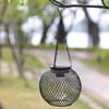 Solar Wrought Iron Lantern Light: Retro Mesh Pendant for Outdoor Garden, Courtyard, and Balcony Ambiance.