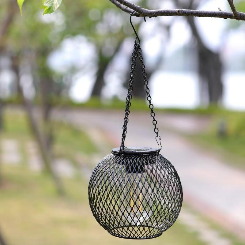 Solar Wrought Iron Lantern Light: Retro Mesh Pendant for Outdoor Garden, Courtyard, and Balcony Ambiance.