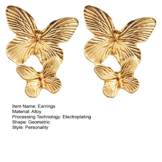 Богемные изящные золотые серьги с большими листьями-бабочками. Большие изящные золотые серьги-капли нерегулярной спирали с веерными листьями. Массивные очаровательные серьги. Ювелирные изделия в стиле панк.