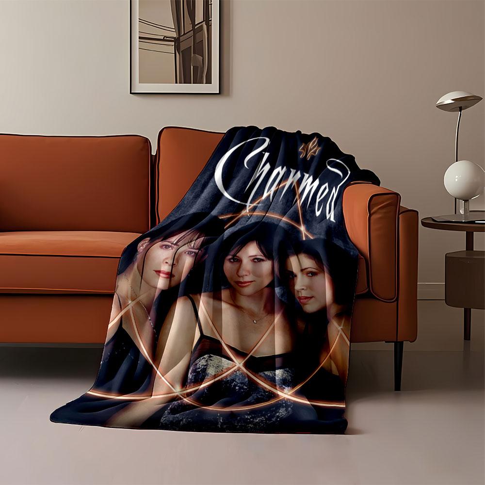 Glowing interlocking circular patterns surrounding three women. for all seasons blanket lunch break throw gift