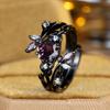 Vintage black and gold hexagonal ring with purple diamonds Forest-inspired branch and leaf design, a touch of understated luxury