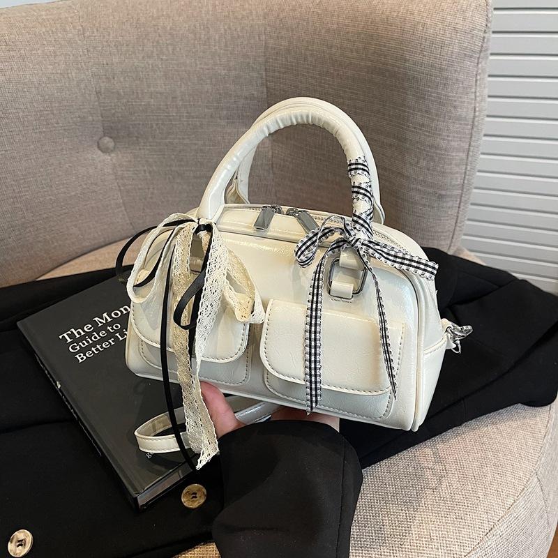 Маленькая сумка в иностранном стиле высокого класса, женская летняя 2025, новая модная нишевая сумка-мессенджер, женская портативная сумка-бостон