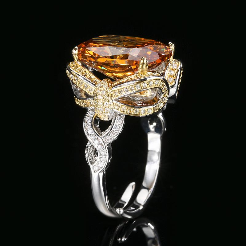 Ювелирные изделия Медь с золотым покрытием Имитация красного корунда Синяя шпинель Кольцо с бантом 12 * 16