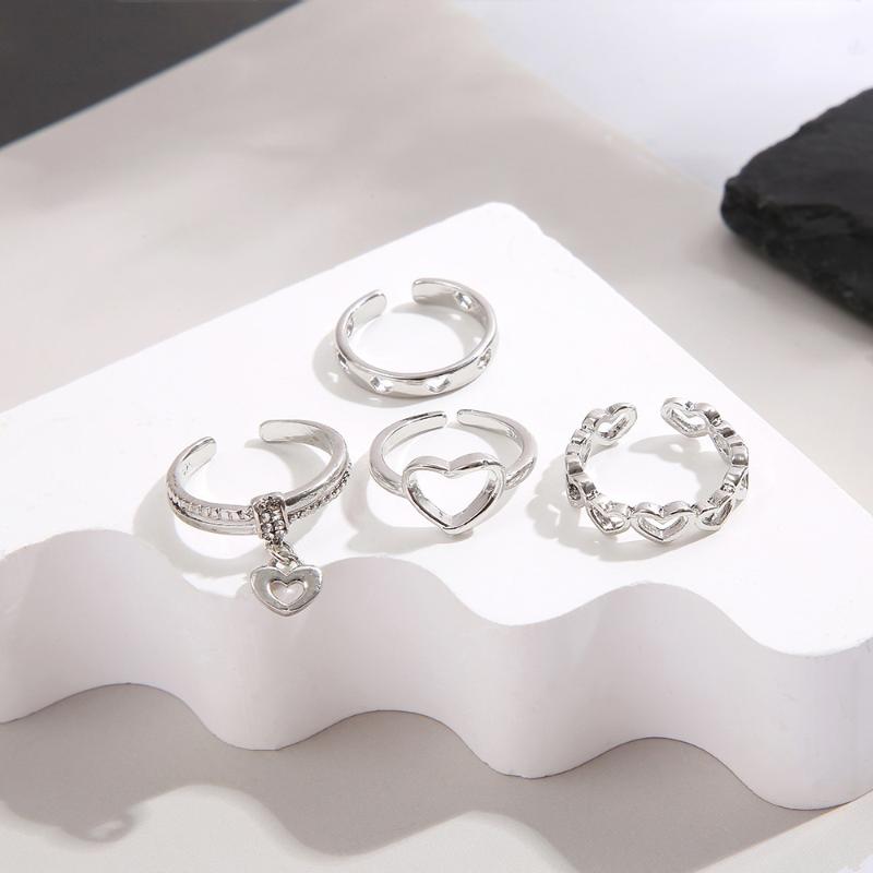 4-Piece Set Of Creative Hollowed-Out Heart Rings Featuring Minimalist Style With Open Knuckles Index Finger Exuding Elegance