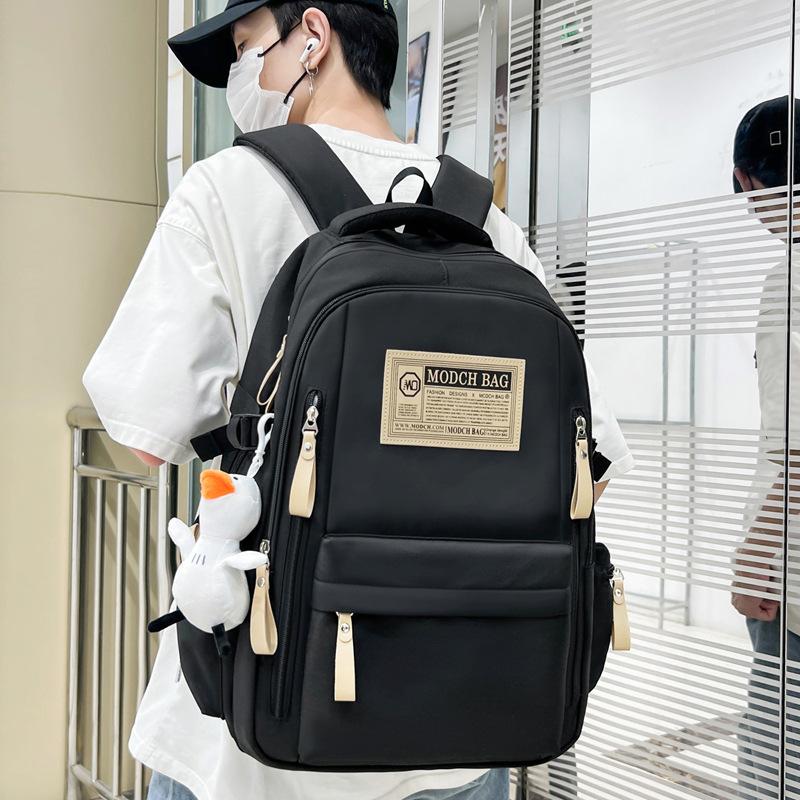 Schoolbag is specially designed for new schoolbags, female students, nylon retro simple, junior high school students, male large-capacity couple .