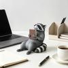 Book-Holding Plastic Raccoons Figurine Shelf Sitter with Sitting Form and Gray-and-Black Detail, a Reading-Themed Accent for Desks, Bookshelves