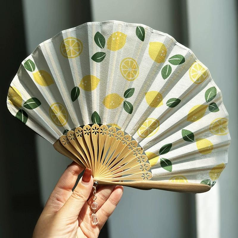 Qimo Original Fresh and Stylish Niche Style Folding Fan Mini and Simple Shell Fan Chinese Ancient Style Ancient Chinese Clothing Fan Summer Lemon
