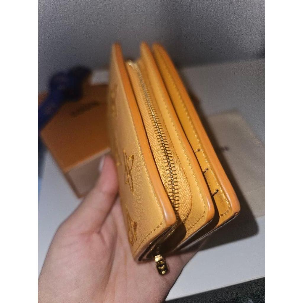 Used Louis Vuitton bi-fold wallet orange