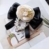 Modern Pearl Floral Pin With Butterfly Knot Design For Adult Formal Wear