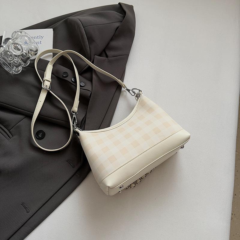 Премиальная маленькая сумка в иностранном стиле женская 2025 новая летняя универсальная на плечо под мышку сумка для通勤 супер огонь сумка-ведро