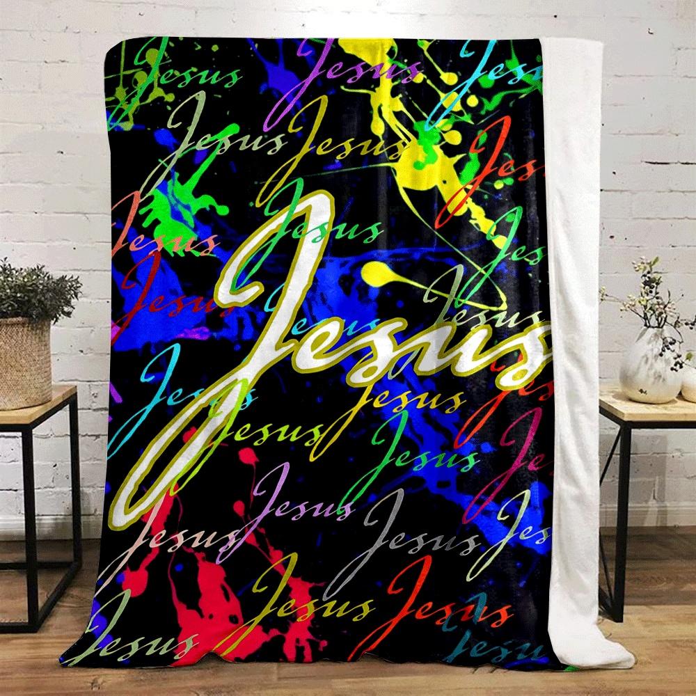 Colorful splatter background with repeating "Jesus" text in cursive style. for all seasons blanket lunch break throw gift