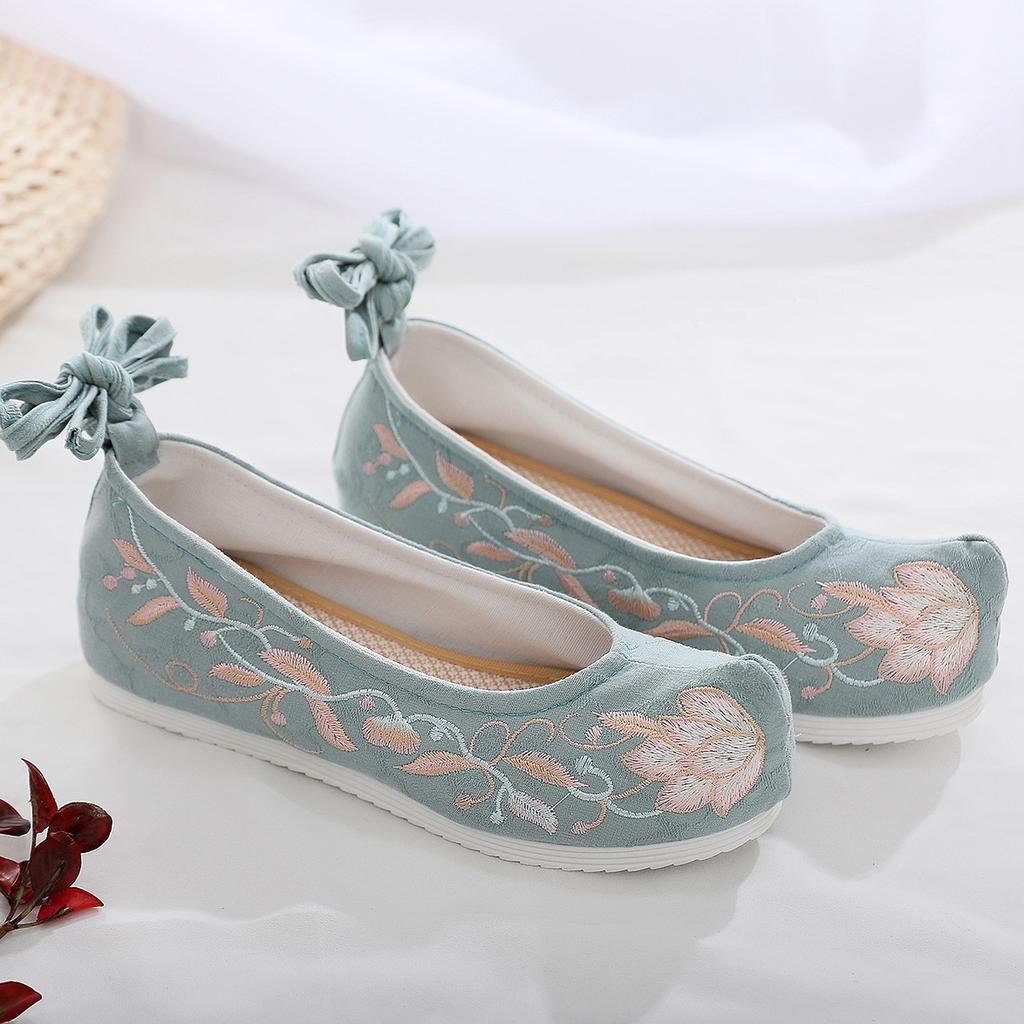 Весной и осенью Melaleuca старинные вышитые женские туфли приобретают деформированную голову Джокера в стиле ретро.