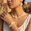 Boho Hawaiian Plumeria Flower Jewelry Set for Women Polymer Clay Cowrie Shell Choker Necklace Woven Bracelet Earrings Vacation