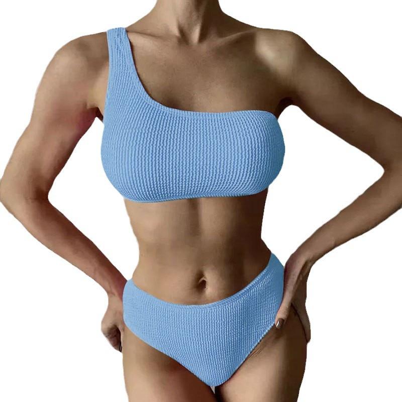 Igo new European and American bikini sexy solid color split wave cloth shoulder swimsuit women's bikini swimsuit