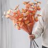 An artificial butterfly branch used for weddings, family offices, parties, decorating vases, and floral arrangements