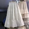 Весна 2025 года, новая юбка А-образной формы с эластичной талией и бантом, французская милая кружевная белая юбка с ажурными вставками